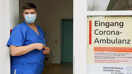 FILE PHOTO: A chief nurse stands in the entrance to a newly opened coronavirus disease clearing-up centre in Dresden © REUTERS/Matthias Rietschel