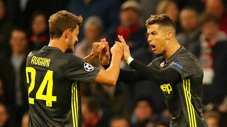 FILE PHOTO: Juventus' Cristiano Ronaldo celebrates scoring their first goal against AFC Ajax with Daniele Rugani.