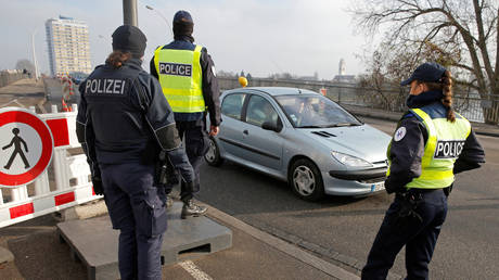 FILE PHOTO. French and German police pictured at the French-German border.