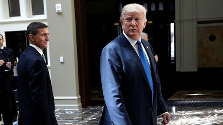 Donald Trump and Michael Flynn walk through Trump International Hotel in Washington, DC