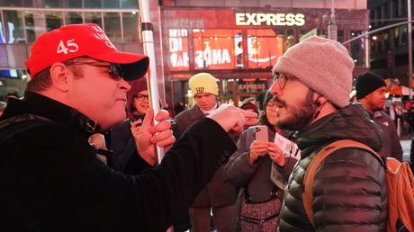 A Trump supporter argues with a Trump protester in New York