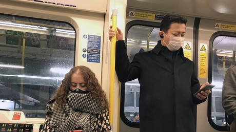 Commuters don face masks on the London Underground © Mark Thomas/Global Look Press/Keystone Press Agency