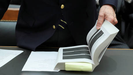 Special Counsel Robert Mueller's heavily redacted report is shown during a House Judiciary Committee hearing in Washington, June 10, 2019.