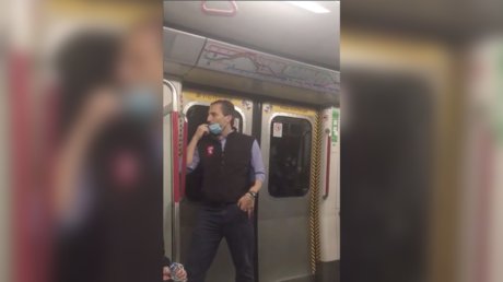 Hedge fund guy in hot water after licking finger & wiping Hong Kong metro handrail in ill-conceived ‘fake news’ stunt (VIDEOS)
