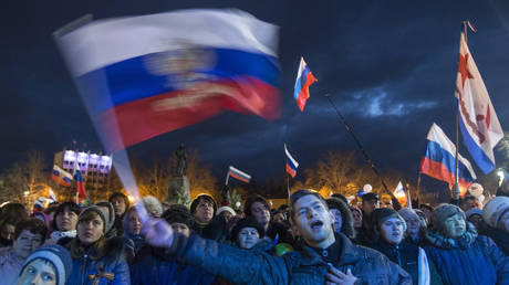 FILE PHOTO: People take part in celebrations on the anniversary of Crimea's return to the Russian Federation, in Sevastopol, Crimea.