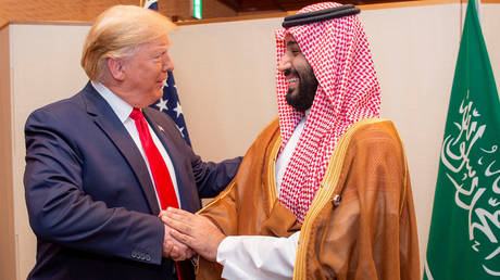 FILE PHOTO: Saudi Arabia's Crown Prince Mohammed bin Salman shakes hands with US President Donald Trump, at the G20 leaders summit in Osaka, Japan.