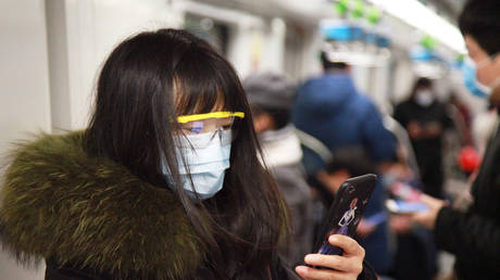 Masked passengers ride a subway train in Nanjing in east China's Jiangsu province © Feature China/Barcroft Media via Getty Images
