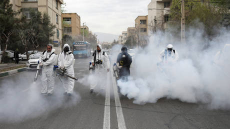 FILE PHOTO. Emergency workers are seen disinfecting streets of Tehran, Iran.