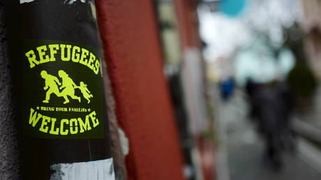 FILE PHOTO: A sticker is seen outside a bar in the old town of Freiburg, Germany, January 24, 2016