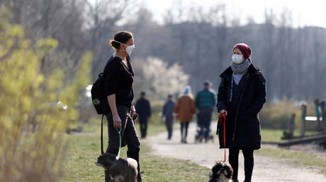 People wearing protective masks in Berlin, Germany March 28, 2020