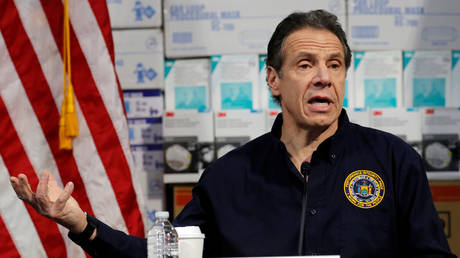 FILE PHOTO: New York Governor Andrew Cuomo speaks in front of stacks of medical protective supplies at a press conference in New York, March 24, 2020 © Reuters / Mike Segar