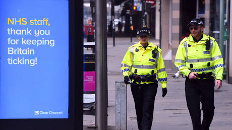 Police officers in Glasgow, Britain. March 27, 2020. © AFP / Andy Buchanan