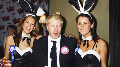 FILE PHOTO: Boris Johnson with UK TV Bunny Girls at the 25th anniversary and book launch party for cult adult comic, Viz Magazine, at the Cafe de Paris on October 27, 2004 in London