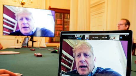 File photo of British PM Boris Johnson chairing a Covid-19 meeting while in self-isolation © Handout via REUTERS / Andrew Parsons