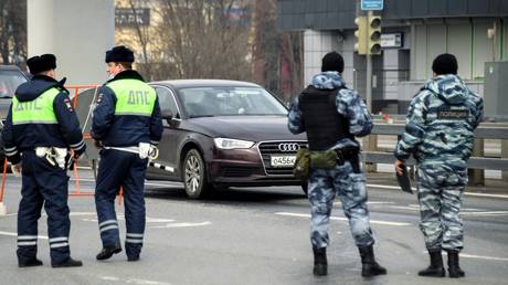 Traffic policemen check documents of the drivers entering the city during mandatory self-isolation due to coronavirus disease outbreak, in Moscow, Russia.