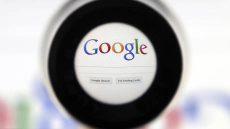 A Google search page is seen through a magnifying glass in this photo illustration taken in Brussels © Reuters / Francois Lenoir