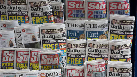 FILE PHOTO: Stand of tabloid newspapers at a newsagents in London, UK, 2014 © Getty Images / In Pictures Ltd./ Corbis