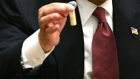 FILE PHOTO: Vial representing Anthrax in the hand of US Secretary of State Colin Powell during his address to the UN Security Council February 5, 2003 in New York City