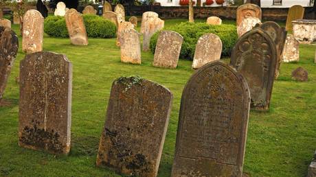 Gunman opens fire at Manchester funeral before being STABBED