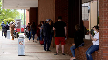 People wait in line to file for unemployment following an outbreak of the coronavirus in Fort Smith, Arkansas