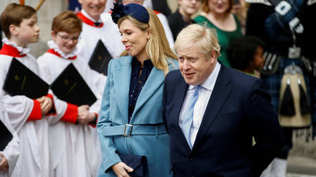 FILE PHOTO: Britain's Prime Minister Boris Johnson and his partner Carrie Symonds leave after the annual Commonwealth Service at Westminster Abbey in London, Britain March 9, 2020. © REUTERS/Henry Nicholls
