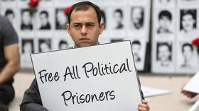 Iran releases ‘political prisoners’ amid Covid-19 outbreak, while virus-stricken UK keeps Assange behind bars