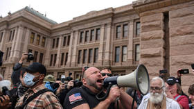 ‘Fire Fauci, let us work’: No social distancing as Alex Jones joins hundreds in rally against Covid-19 lockdown measures in Texas