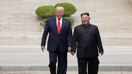 FILE PHOTO: US President Donald Trump meets with North Korean leader Kim Jong-un, June 30, 2019