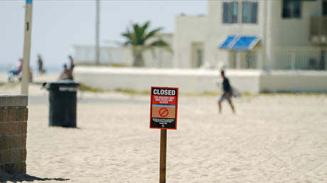 &lsquo;Beach wars&rsquo; heat up as &lsquo;arbitrary&rsquo; rules gall stir-crazy Americans determined to enjoy early summer