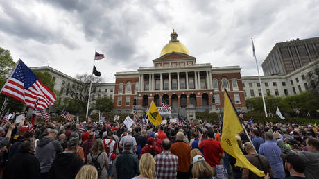 Protesters rally to demand an end to a statewide 'stay at home' order outside the Massachusetts State House in Boston, May 4, 2020