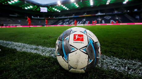 German football chief insists league WILL restart as planned despite ENTIRE TEAM entering self-isolation after coronavirus tests