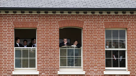 FILE PHOTO: Pupils watch during the visit by Britain's Prince Charles to open the new Bekynton Field Development building at Eton College near Windsor, Britain June 9, 2015