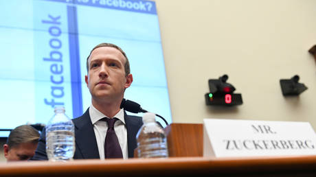 FILE PHOTO: Mark Zuckerberg testifies at a House Financial Services Committee hearing in Washington, U.S., October 23, 2019