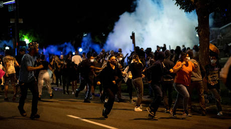 People run during a protest in Denver, Colorado, US. May 28, 2020.
