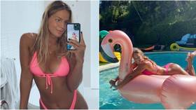 In the pink: Russian swim star Efimova poses in pool with flamingo as she soaks up California sun (PHOTOS)