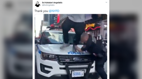 NYPD teaches masked protester a BRUTAL lesson after he dares climb onto a police car (VIDEO)