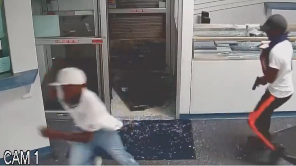 CCTV footage released by police shows armed people in looted shop near where black cop David ...