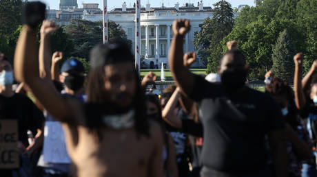 Protesters march at the White House during a rally against the death in Minneapolis police custody of George Floyd, in Washington, DC, U.S. May 31, 2020.