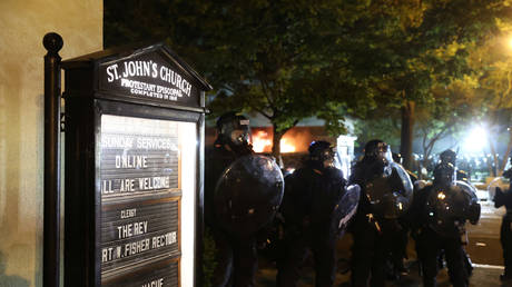 Law enforcement personnel clash with protesters near St. John's Church in Washington, DC, US, May 31, 2020