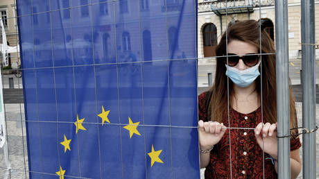 A woman on the Slovenian side of the new wall that divide the city of Gorizia and Nova Gorica in the Transalpina square, Gorizia, 23th May, Italy