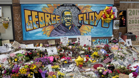 A growing memorial site at the spot where George Floyd was killed by a police officer