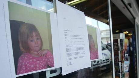 FILE PHOTO. Pictures of missing 3-year-old British girl Madelaine McCann are seen in Praia de Luz in 2007.