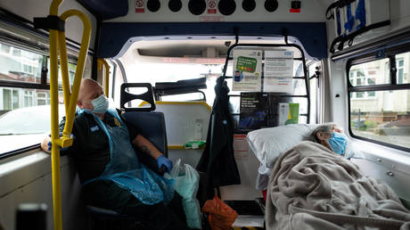 An elderly non-COVID-19 patient is moved from hospital to a care home, near Portsmouth, Britain © REUTERS/Leon Neal/Pool