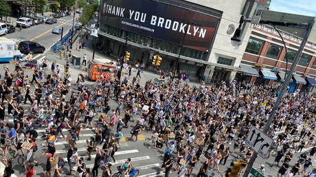 Demonstrators march down Flatbush Avenue toward the Manhattan Bridge in New York, US, June 6, 2020