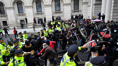 FILE PHOTO: Police clash with demonstrators in Whitehall during a Black Lives Matter protest in London, Britain, June 7, 2020