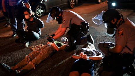 Police detain protesters during a rally in Atlanta, Georgia, US, June 13, 2020