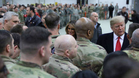 US President Donald Trump and first lady Melania Trump greet U.S. troops at Ramstein Air Force Base in Germany in 2018.  © Reuters / Jonathan Ernst