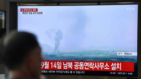 A television news screen showing an explosion of an inter-Korean liaison office on June 16, 2020