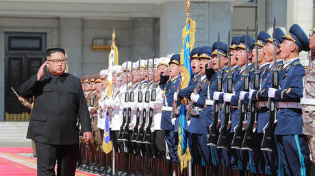 FILE PHOTO: North Korea's leader Kim Jong Un (2nd L) reviewing an honour guard at the 70th founding anniversary of the Democratic People's Republic of Korea (DPRK) in Pyongyang