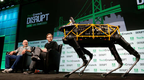 FILE PHOTO: Boston Dynamics' Spot robot walks on stage while developer Marc Raibert speaks at a TechCrunch conference in San Francisco, California.
